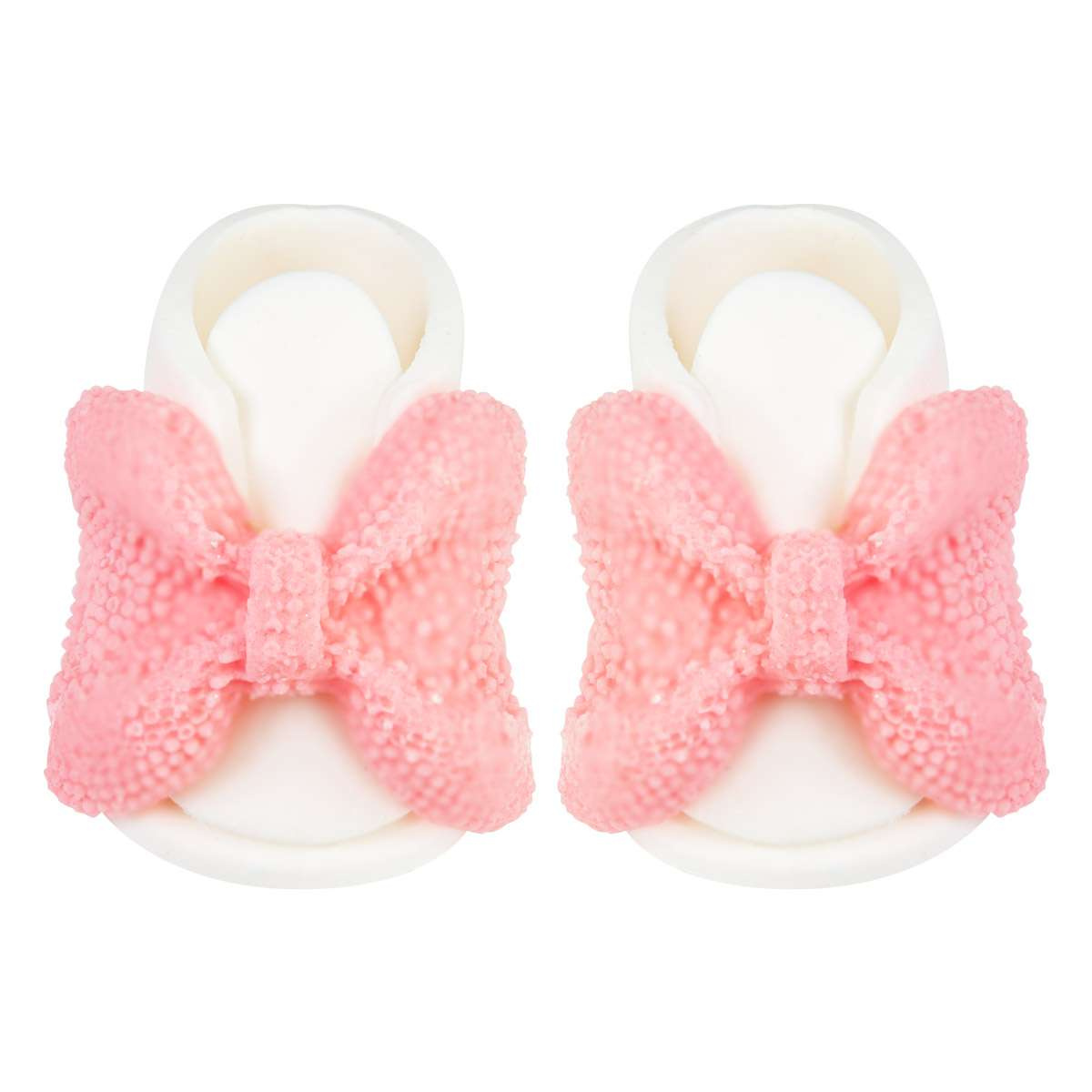 Zbliżenie na różowe buciki cukrowe na tort - detale ręcznego wykonania